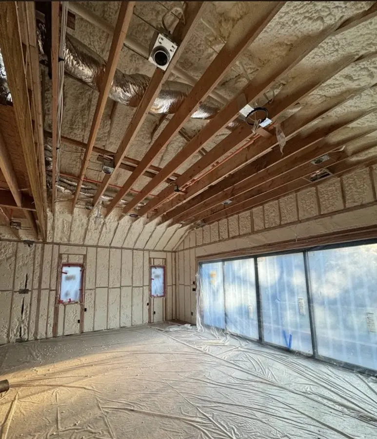 Interior walls and ceiling insulated with spray foam during new construction in Surfside